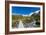 A hiking trail crosses wooden bridge over a creak high up in the mountains, New Zealand-Logan Brown-Framed Photographic Print
