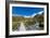 A hiking trail crosses wooden bridge over a creak high up in the mountains, New Zealand-Logan Brown-Framed Photographic Print