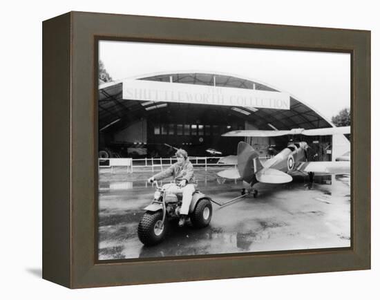 A Honda All Terrain Cycle Pulling a Vintage Biplane, 1982-null-Framed Premier Image Canvas