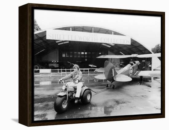 A Honda All Terrain Cycle Pulling a Vintage Biplane, 1982-null-Framed Premier Image Canvas