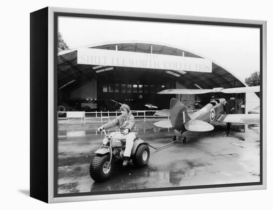 A Honda All Terrain Cycle Pulling a Vintage Biplane, 1982-null-Framed Premier Image Canvas