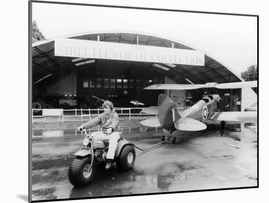 A Honda All Terrain Cycle Pulling a Vintage Biplane, 1982-null-Mounted Photographic Print