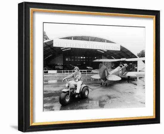 A Honda All Terrain Cycle Pulling a Vintage Biplane, 1982-null-Framed Photographic Print