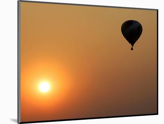 A Hot-Air Balloon Flies Over the Peremilovo Village-null-Mounted Photographic Print