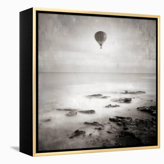 A Hot Air Balloon Floating Above the Sea-Luis Beltran-Framed Premier Image Canvas