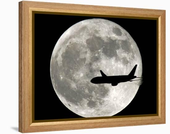 A Jet Plane Passes in Front of the Full Moon Above Surfside, Fla.-null-Framed Premier Image Canvas