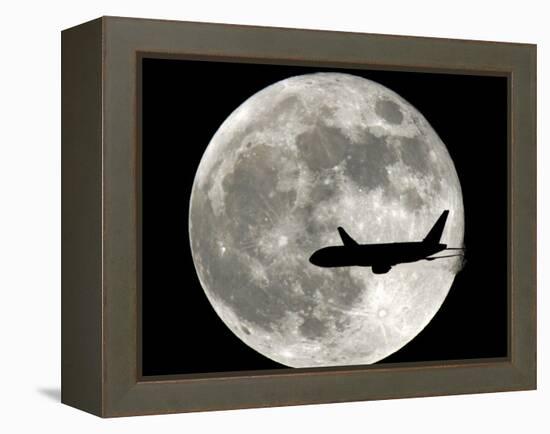 A Jet Plane Passes in Front of the Full Moon Above Surfside, Fla.-null-Framed Premier Image Canvas