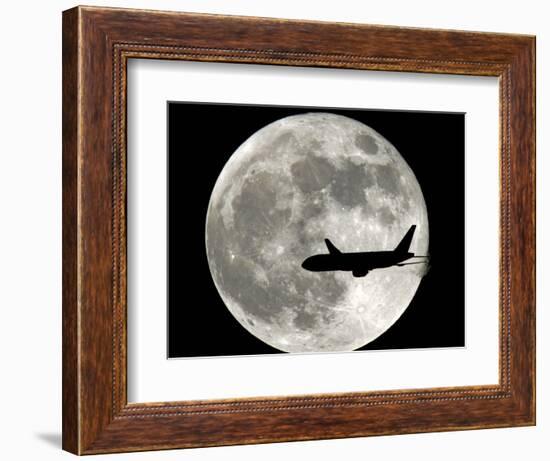 A Jet Plane Passes in Front of the Full Moon Above Surfside, Fla.-null-Framed Photographic Print