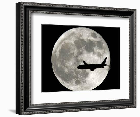 A Jet Plane Passes in Front of the Full Moon Above Surfside, Fla.-null-Framed Photographic Print