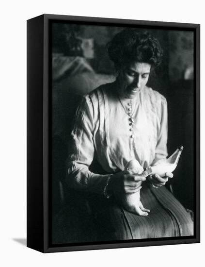 A Keeper's Wife Bottle-Feeds a Newborn Polar Bear Cub, London Zoo, C.1914-Frederick William Bond-Framed Premier Image Canvas