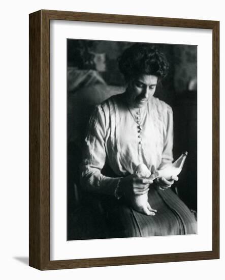 A Keeper's Wife Bottle-Feeds a Newborn Polar Bear Cub, London Zoo, C.1914-Frederick William Bond-Framed Photographic Print