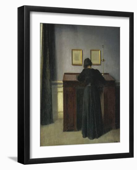 A Lady Writing at Her Desk-Vilhelm Hammershoi-Framed Giclee Print