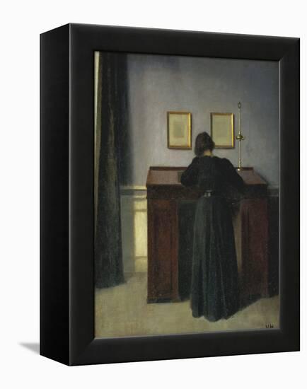 A Lady Writing at Her Desk-Vilhelm Hammershoi-Framed Premier Image Canvas