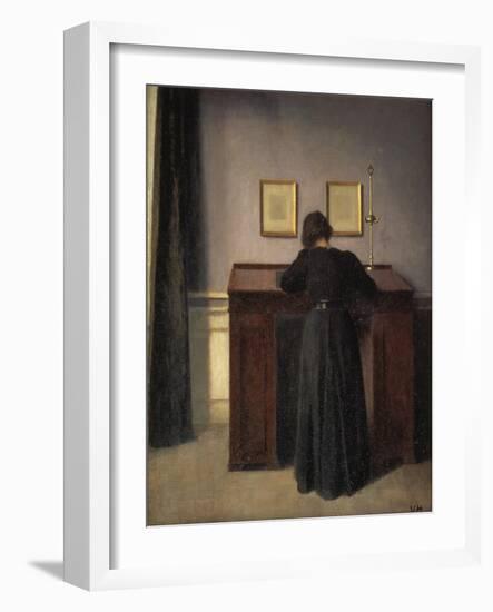 A Lady Writing at Her Desk-Vilhelm Hammershoi-Framed Giclee Print