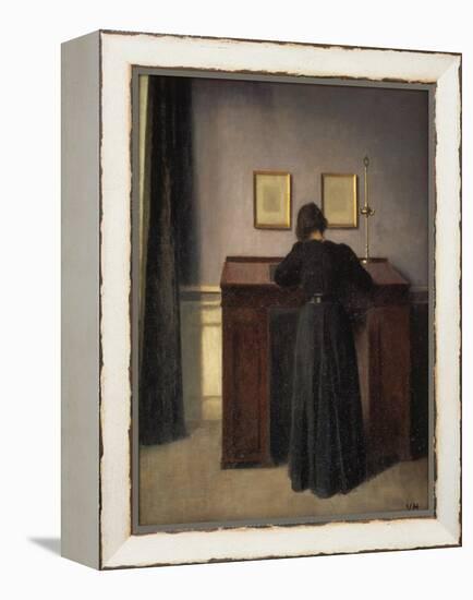 A Lady Writing at Her Desk-Vilhelm Hammershoi-Framed Premier Image Canvas