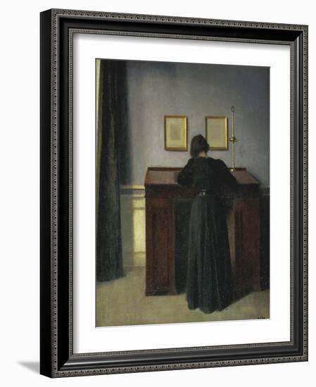 A Lady Writing at Her Desk-Vilhelm Hammershoi-Framed Giclee Print