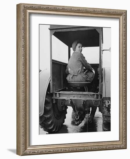 A Land Girl Driving a Tractor on a Farm During World War Ii-Robert Hunt-Framed Photographic Print