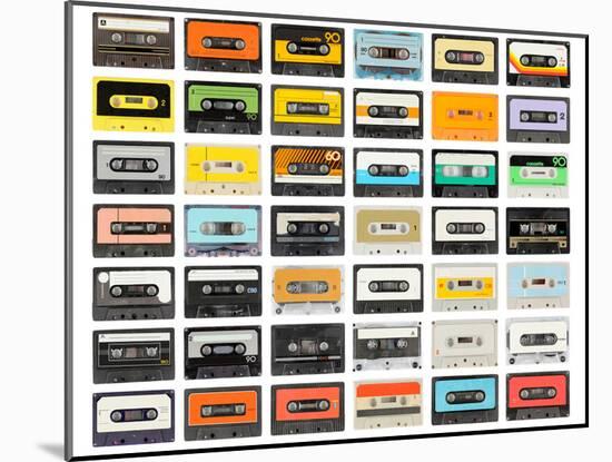 A Large Collection of Retro Cassette Tapes Places in a Grid-dubassy-Mounted Photographic Print