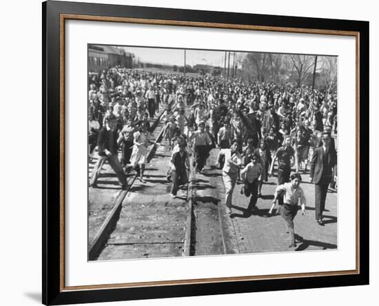 A Large Crowd of People Running Through the Streets During the Dodge City Parade-Peter Stackpole-Framed Premium Photographic Print