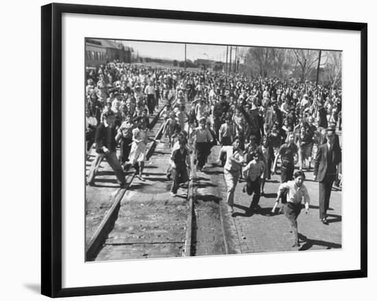 A Large Crowd of People Running Through the Streets During the Dodge City Parade-Peter Stackpole-Framed Premium Photographic Print