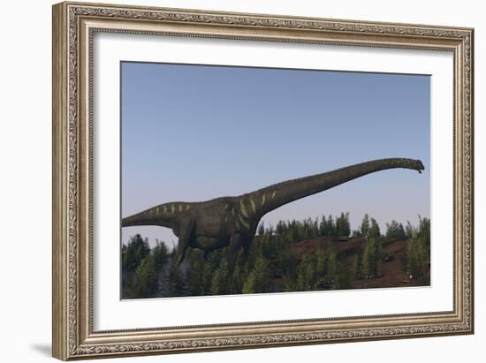 A Large Mamenchisaurus Walking Along a Dry Riverbed-Stocktrek Images-Framed Art Print