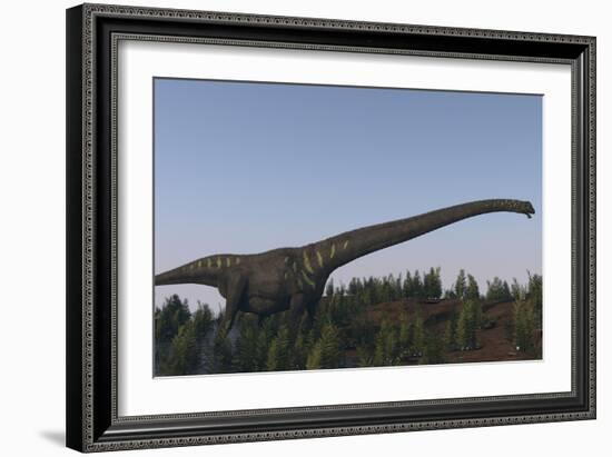 A Large Mamenchisaurus Walking Along a Dry Riverbed-Stocktrek Images-Framed Art Print