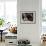 A Little Boy Holding a Banana Whilst Other Children Gaze Longingly at It-null-Framed Photographic Print displayed on a wall