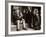 A Little Boy Holding a Banana Whilst Other Children Gaze Longingly at It-null-Framed Photographic Print