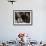 A Little Boy Holding a Banana Whilst Other Children Gaze Longingly at It-null-Framed Photographic Print displayed on a wall