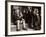 A Little Boy Holding a Banana Whilst Other Children Gaze Longingly at It-null-Framed Photographic Print