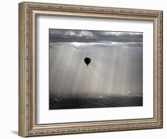 A Lone Balloon Drifts Near the Foothills of Albuquerque, N.M.-null-Framed Photographic Print