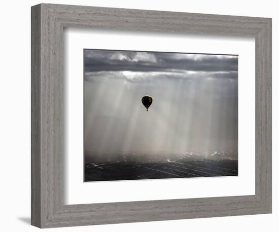 A Lone Balloon Drifts Near the Foothills of Albuquerque, N.M.-null-Framed Photographic Print