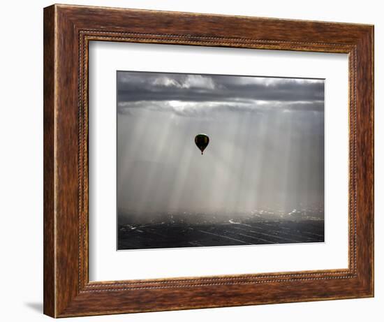 A Lone Balloon Drifts Near the Foothills of Albuquerque, N.M.-null-Framed Photographic Print