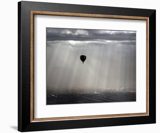 A Lone Balloon Drifts Near the Foothills of Albuquerque, N.M.-null-Framed Photographic Print