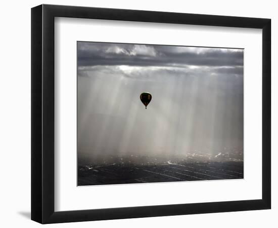 A Lone Balloon Drifts Near the Foothills of Albuquerque, N.M.-null-Framed Photographic Print