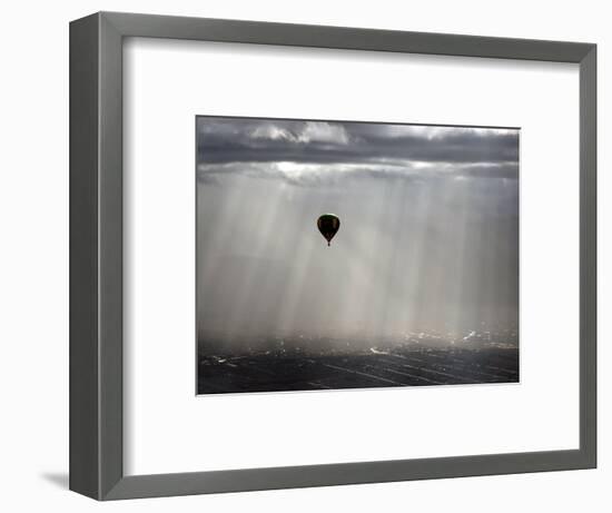 A Lone Balloon Drifts Near the Foothills of Albuquerque, N.M.-null-Framed Photographic Print