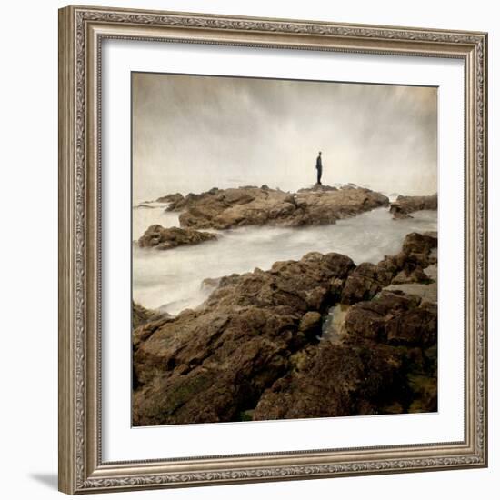 A Lone Man Standing on Large Rocks with the Seas Swirling around Them-Luis Beltran-Framed Photographic Print