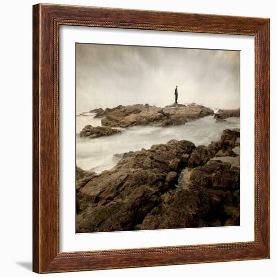 A Lone Man Standing on Large Rocks with the Seas Swirling around Them-Luis Beltran-Framed Photographic Print