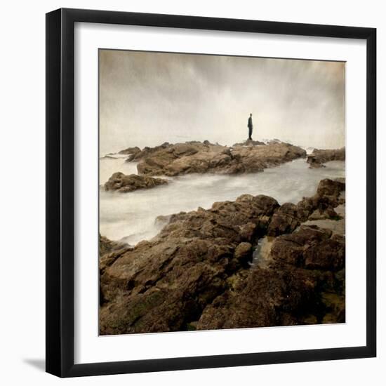 A Lone Man Standing on Large Rocks with the Seas Swirling around Them-Luis Beltran-Framed Photographic Print