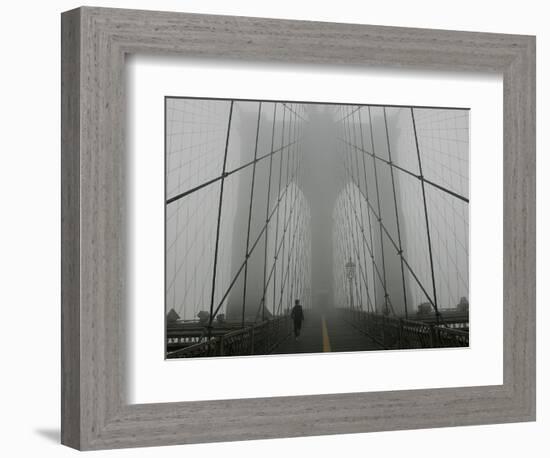 A Lone Runner Makes His Way Across the Fog-Shrouded Brooklyn Bridge Christmas Morning-null-Framed Photographic Print