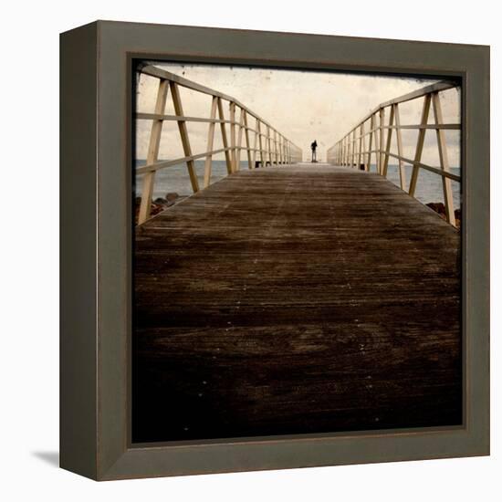 A Long Wooden Walkway at the Sea with a Figure Standing in the Distance-Luis Beltran-Framed Premier Image Canvas