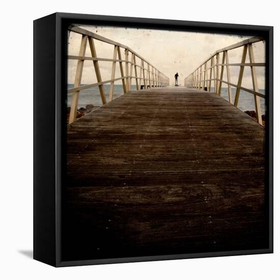 A Long Wooden Walkway at the Sea with a Figure Standing in the Distance-Luis Beltran-Framed Premier Image Canvas