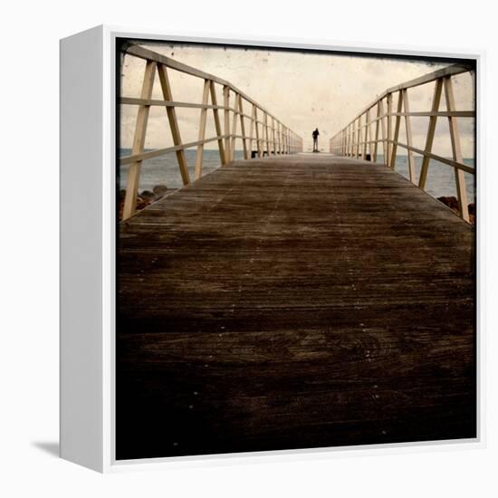 A Long Wooden Walkway at the Sea with a Figure Standing in the Distance-Luis Beltran-Framed Premier Image Canvas