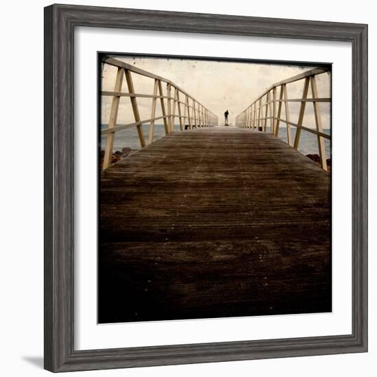 A Long Wooden Walkway at the Sea with a Figure Standing in the Distance-Luis Beltran-Framed Photographic Print