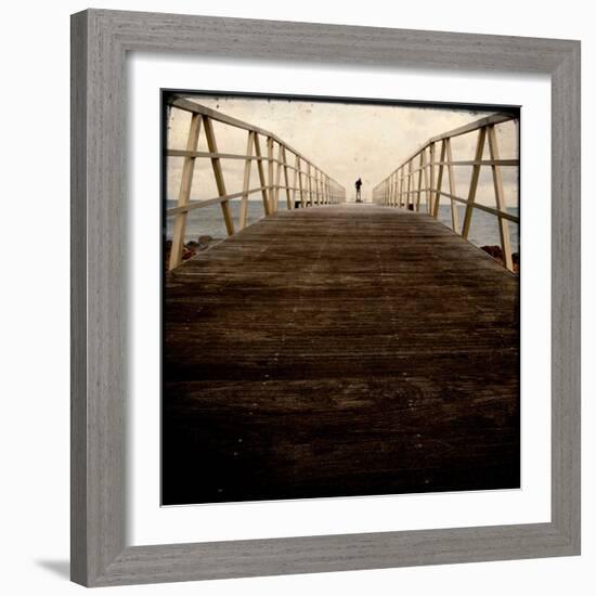 A Long Wooden Walkway at the Sea with a Figure Standing in the Distance-Luis Beltran-Framed Photographic Print