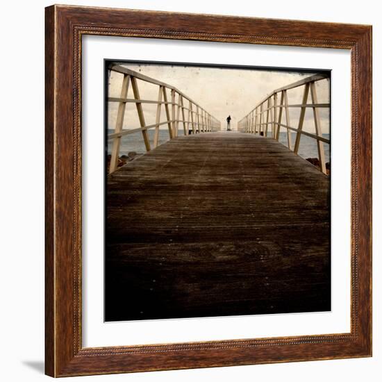 A Long Wooden Walkway at the Sea with a Figure Standing in the Distance-Luis Beltran-Framed Photographic Print