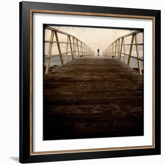 A Long Wooden Walkway at the Sea with a Figure Standing in the Distance-Luis Beltran-Framed Photographic Print