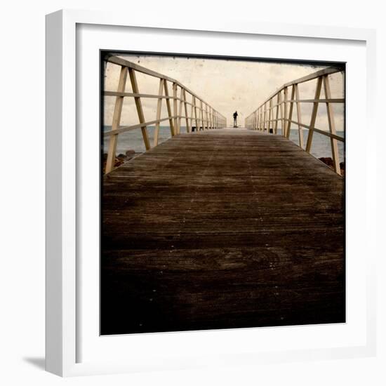 A Long Wooden Walkway at the Sea with a Figure Standing in the Distance-Luis Beltran-Framed Photographic Print