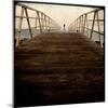 A Long Wooden Walkway at the Sea with a Figure Standing in the Distance-Luis Beltran-Mounted Photographic Print