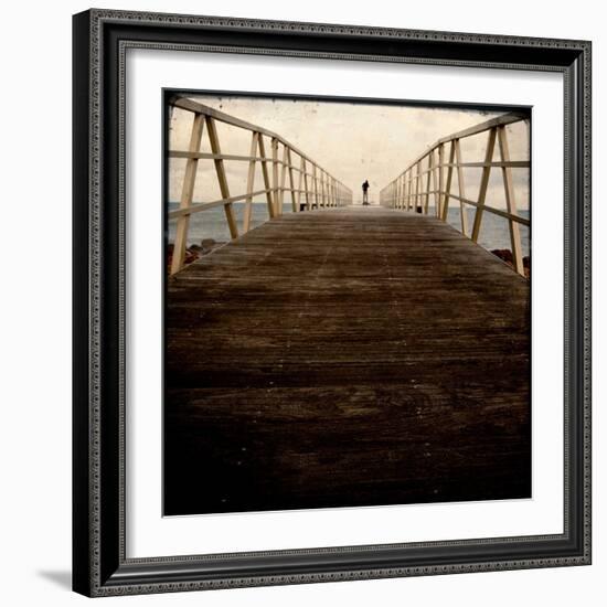 A Long Wooden Walkway at the Sea with a Figure Standing in the Distance-Luis Beltran-Framed Photographic Print